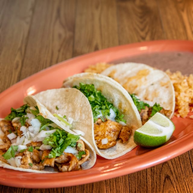 Lunch 3 Tacos with Rice & Beans.